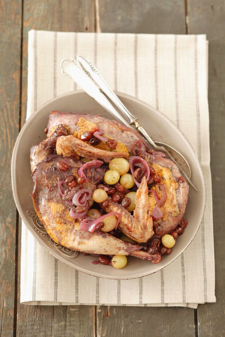 Pheasant with grapes and onions in red wine