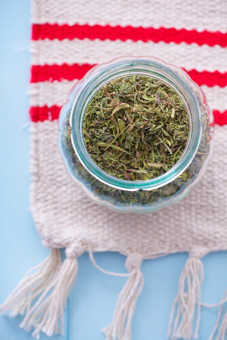 Jar of dried summer savory