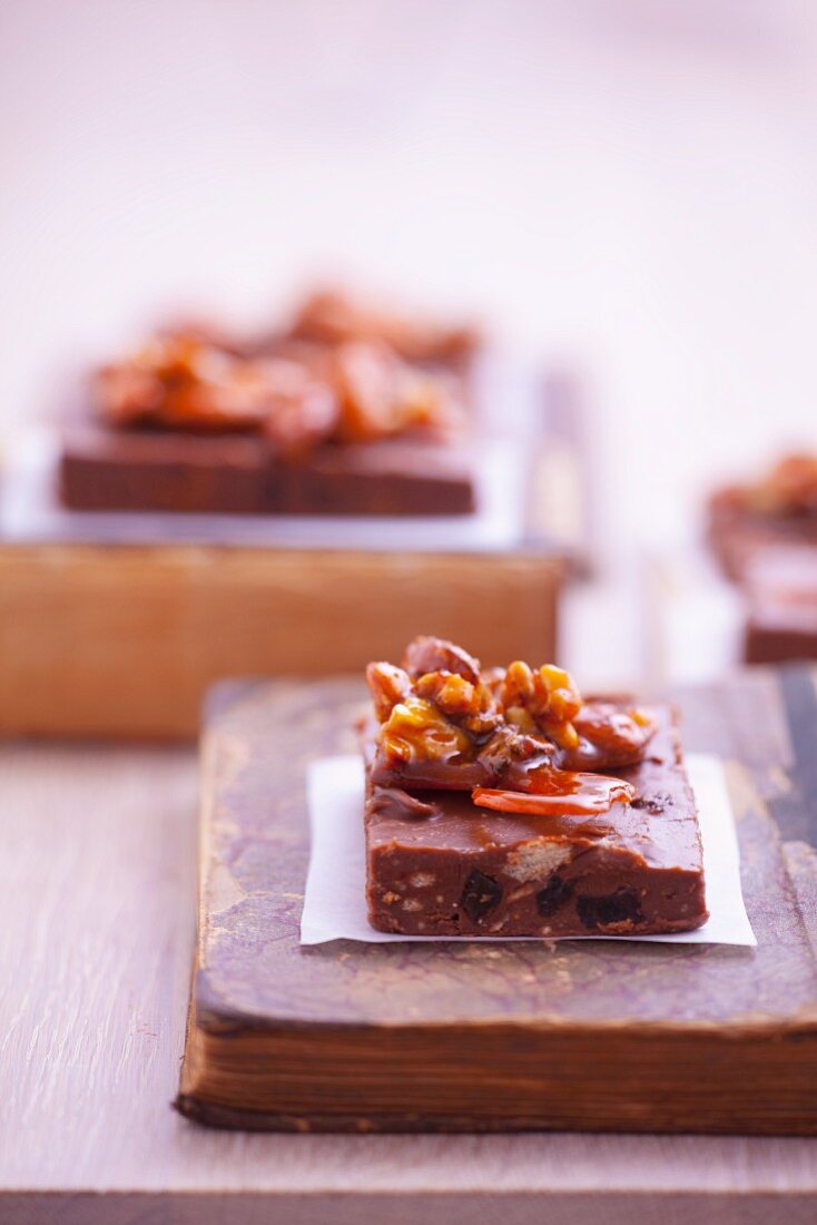 Chocolate refrigerator cake garnished with roasted almonds with caramel