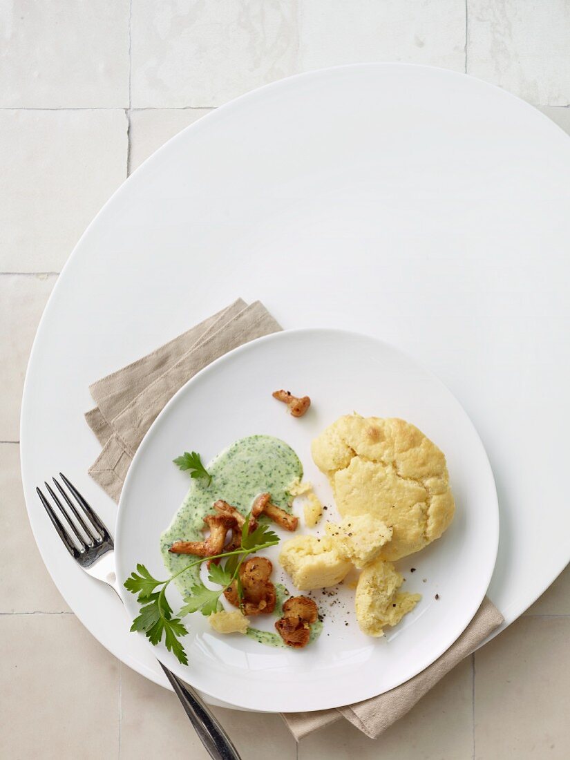 Potato pancake with herb sauce and chanterelles