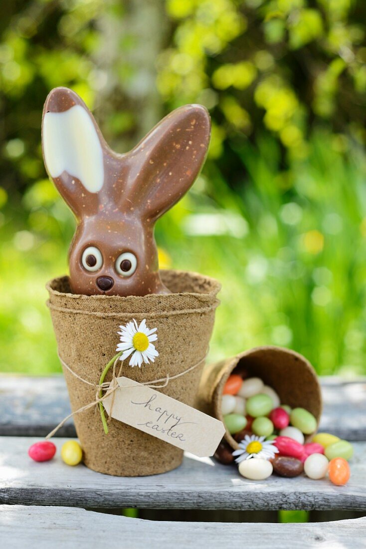 Chocolate bunny and jelly beans on a garden table