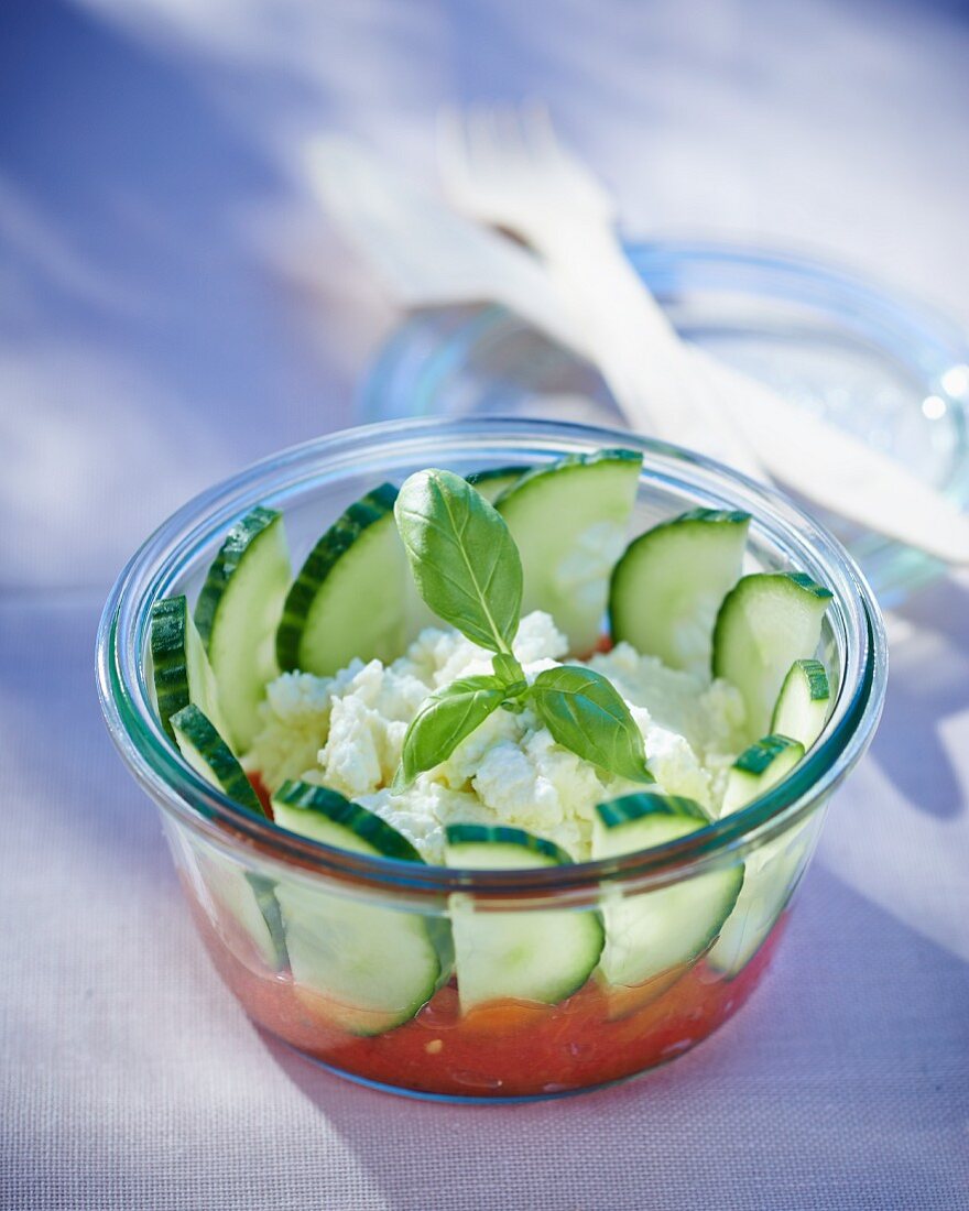 Cucumber salad with fresh goat's cheese and tomatoes