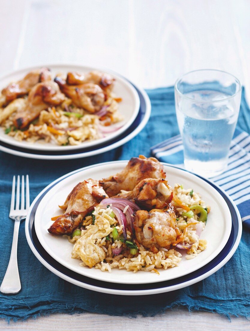 Lemon chicken legs on fried rice