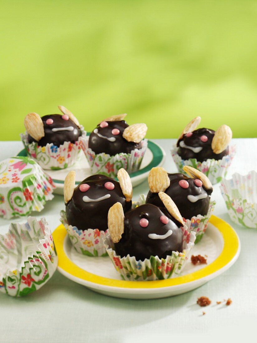 May bug muffins with chocolate icing and almonds