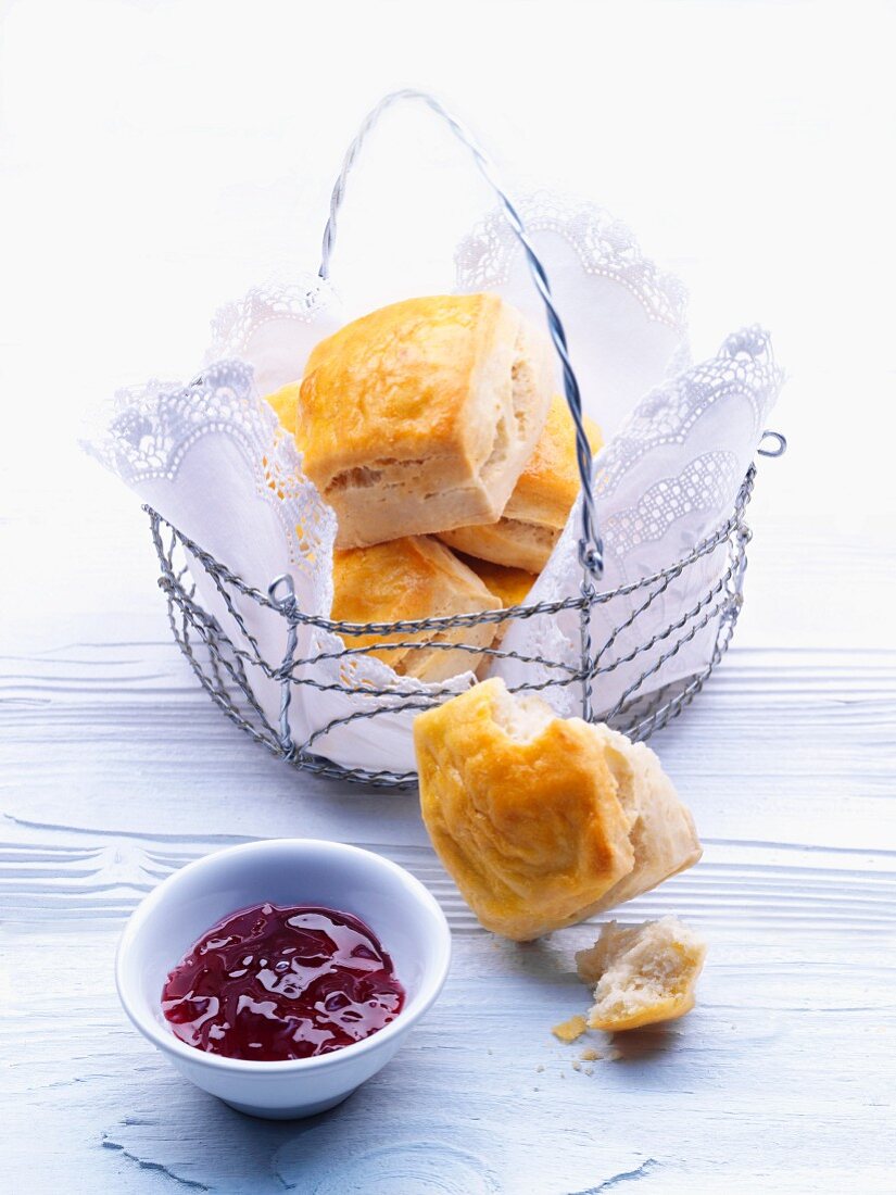 Scones in a bread basket with jam