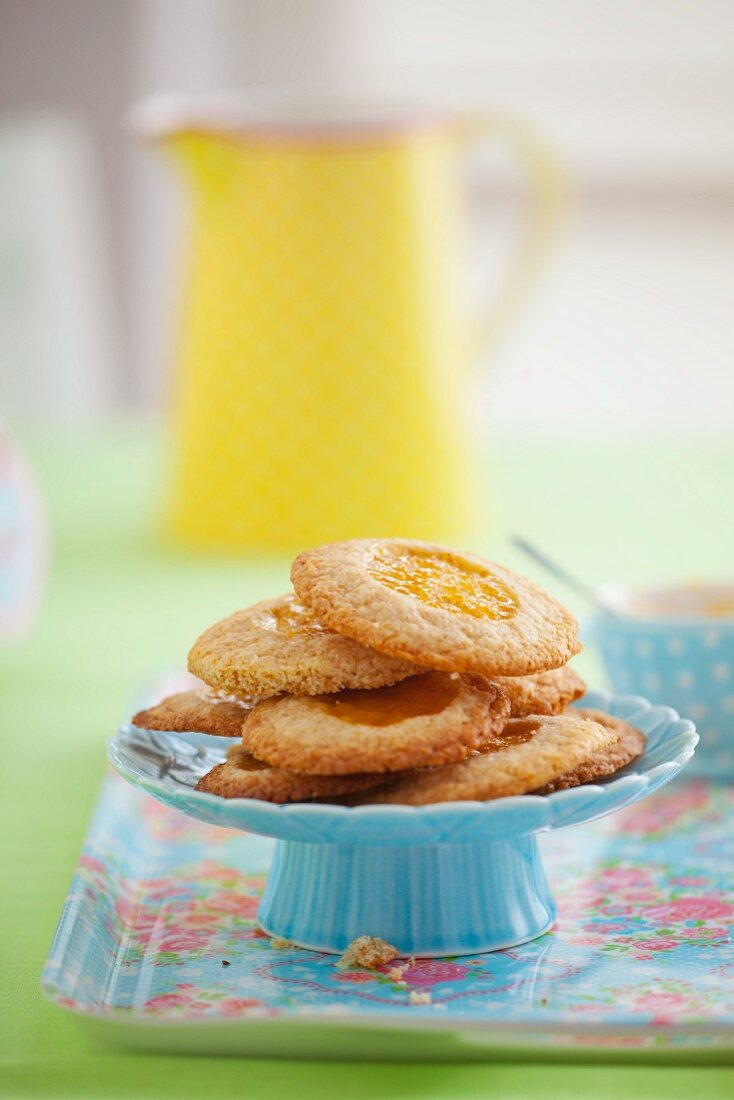 Wholegrain biscuits with peach jam on a cake stand