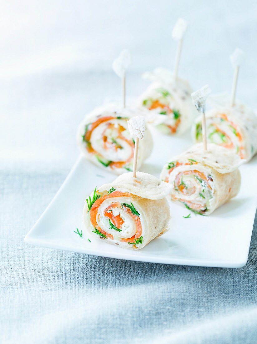 Tortilla rolls filled with smoked salmon, cream cheese and dill