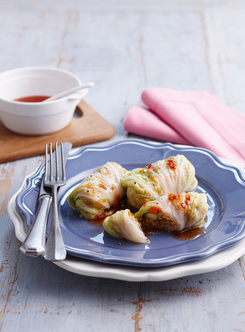 Leaves of Chinese cabbage wrapped around a minced meat and rice filling