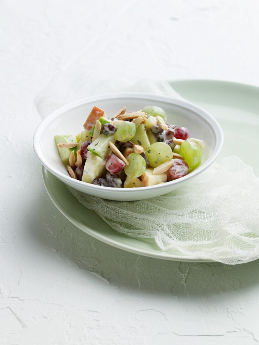 Grape and Apple Salad in a Yogurt Honey Dressing with Almonds in a Bowl