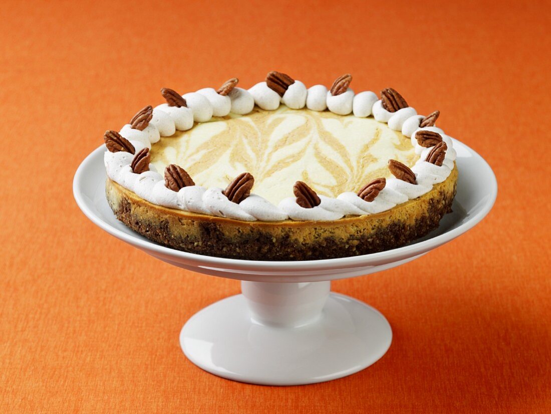 Pumpkin Marbled Cheesecake with Pecans and Gingersnap Cookie Crust