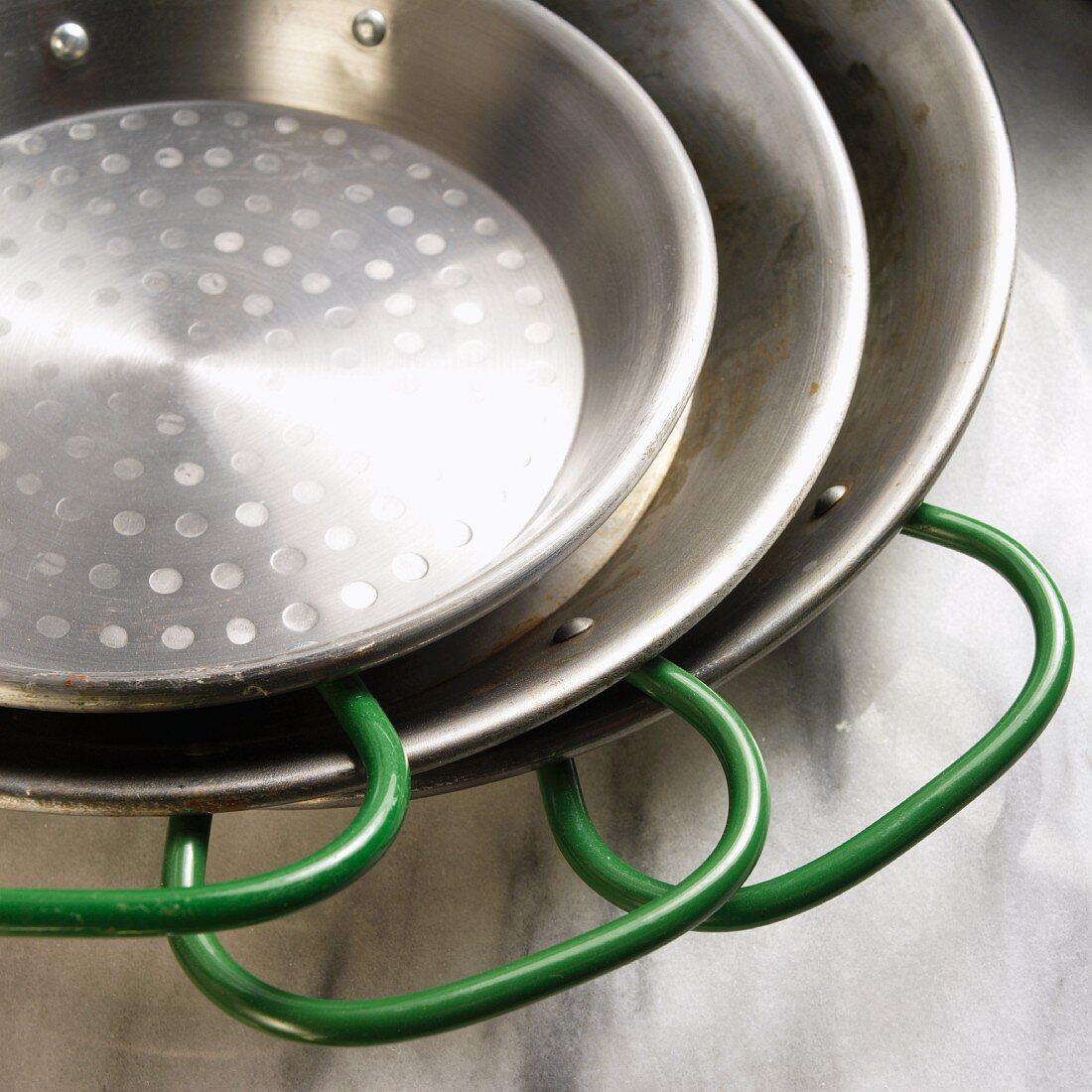 Three Green Handled Pans; Stacked