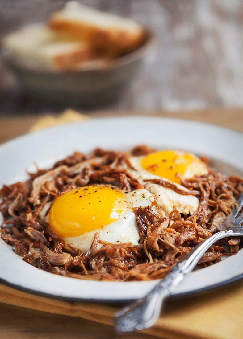 A Plate of Fried Eggs on Pulled Pork