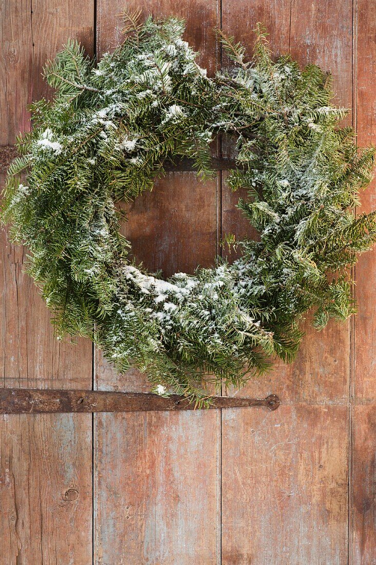 Christmas wreath on wooden door