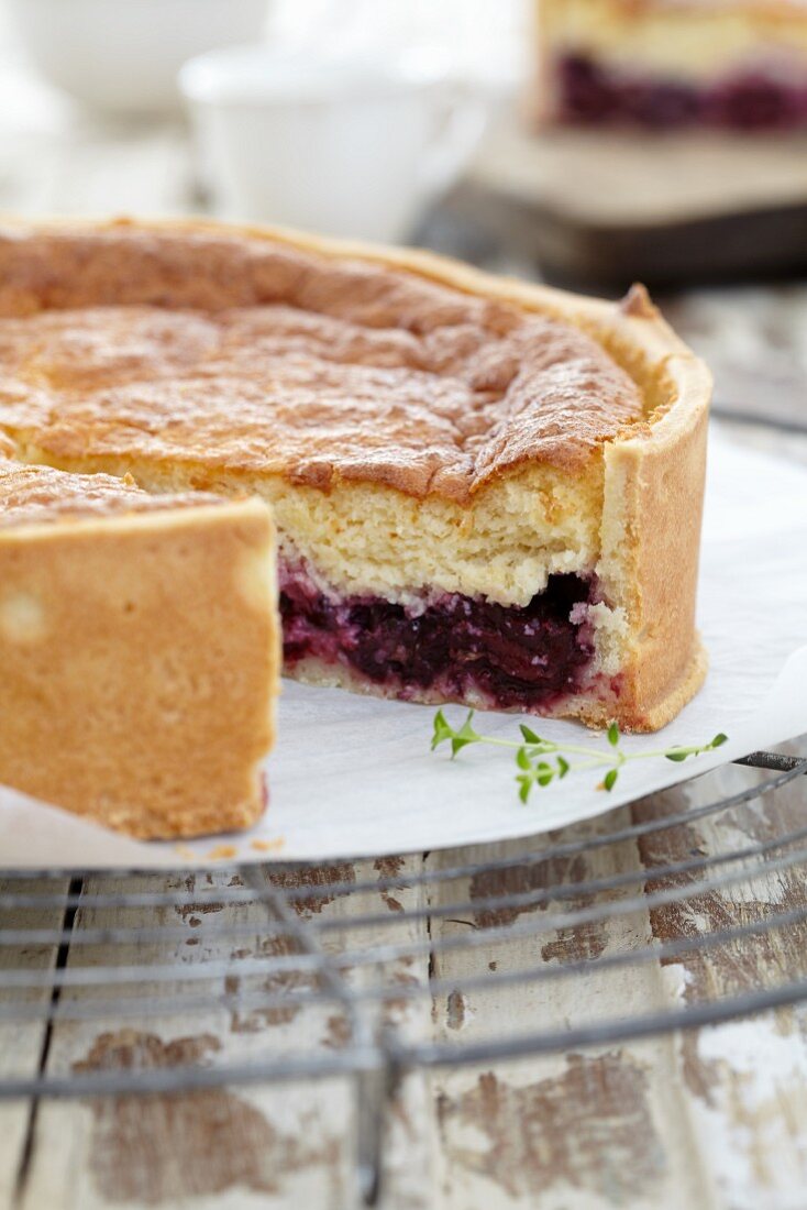 Baked blackberry & cream cake, sliced open