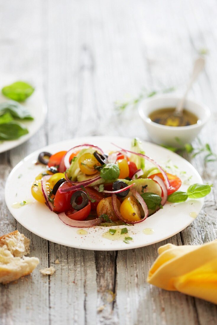 Colourful tomato salad with black olives