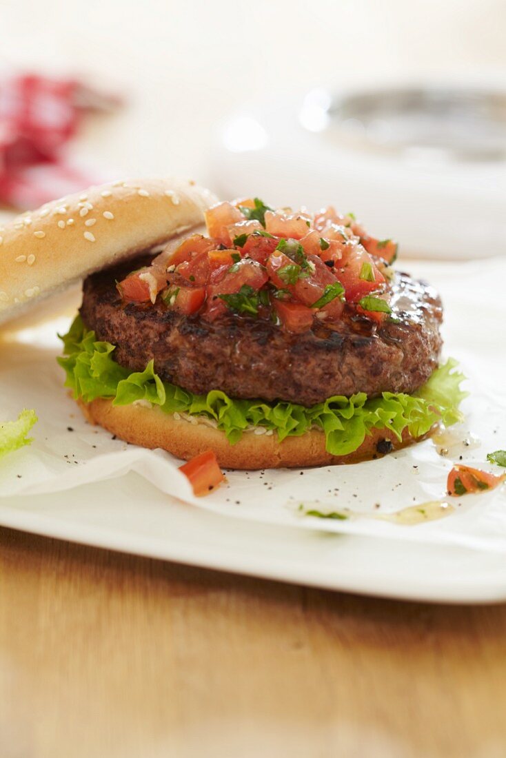 Grilled burger with tomato salsa