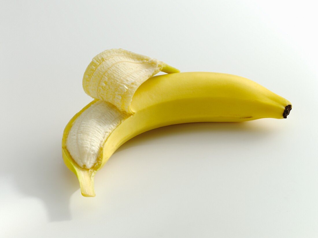A partly peeled banana