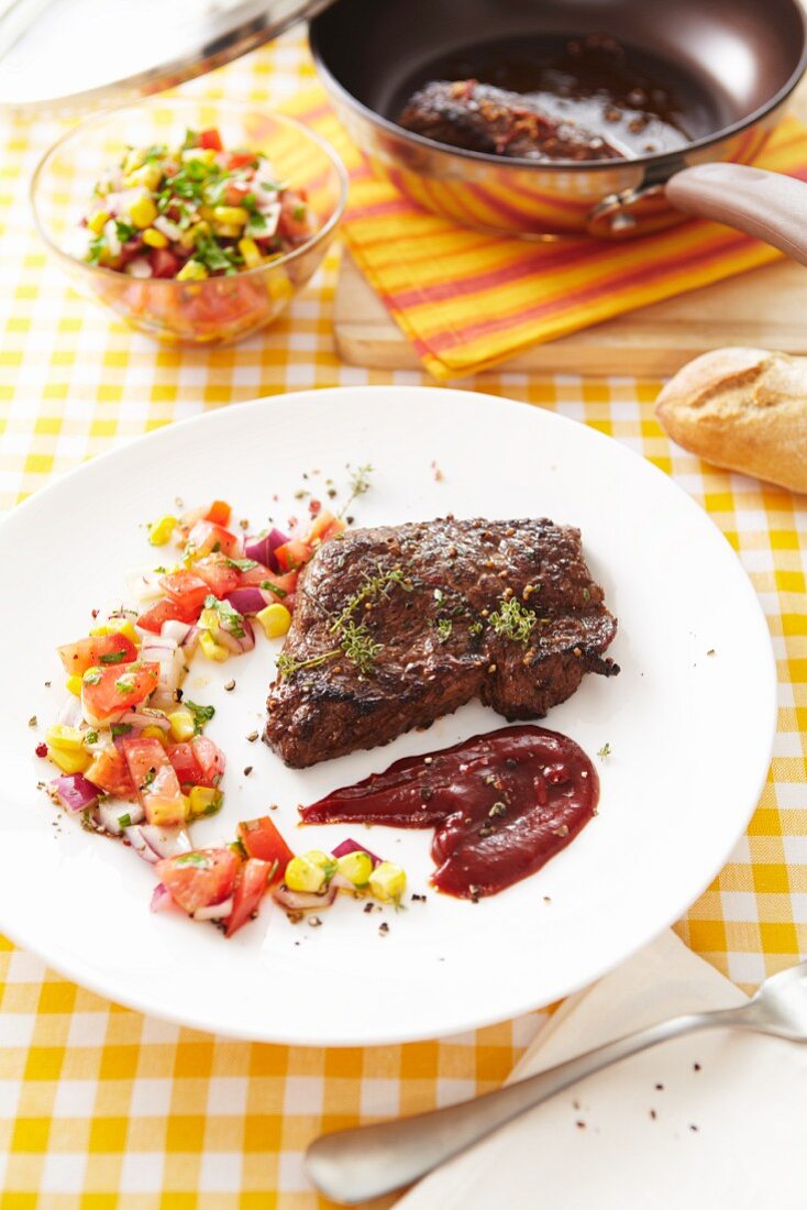 Peppered steak with a tomato and sweetcorn relish
