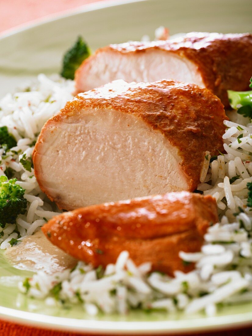 Tandoori pork fillet on a bed of rice