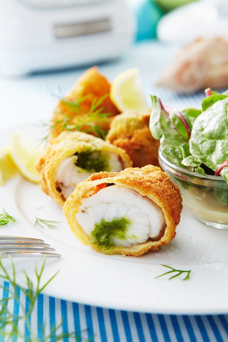 Breaded monk fish rolls with pesto filling