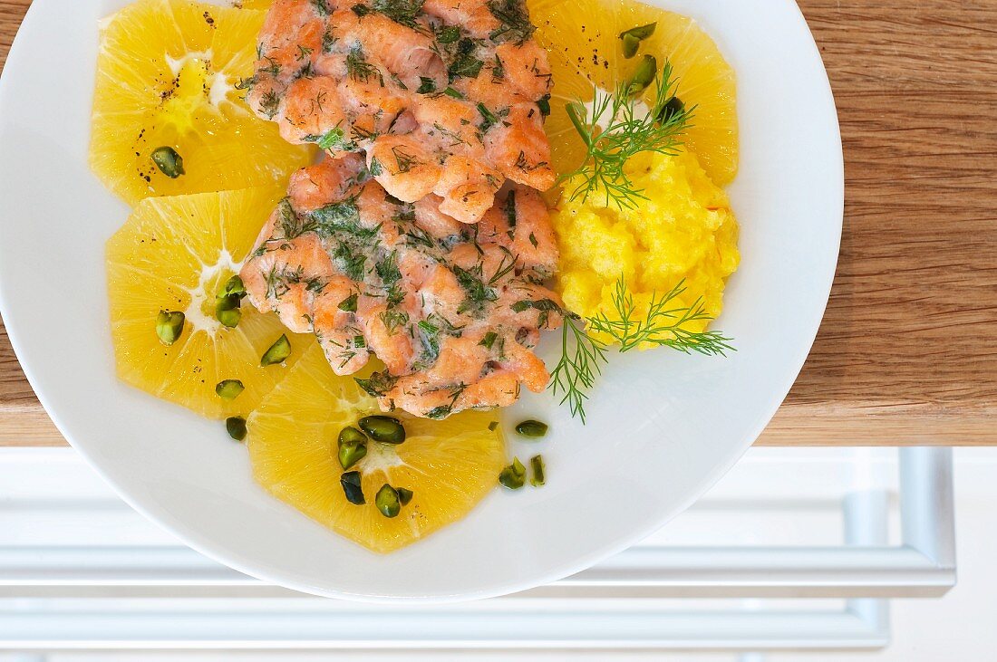 Salmon fritters with a fennel dip and orange slices