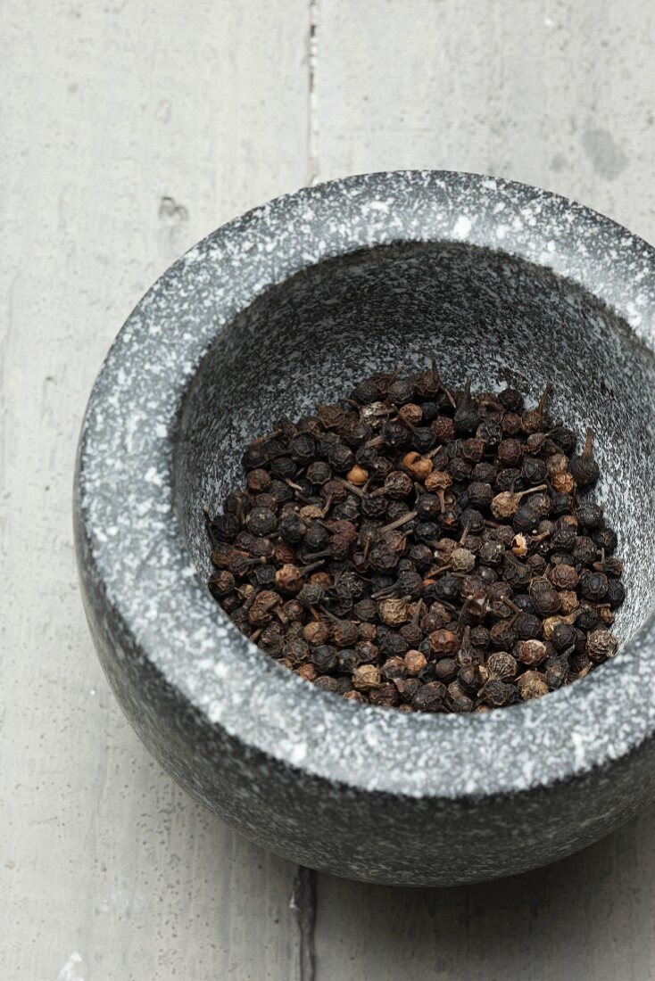 Cubeb (tailed pepper) in a mortar