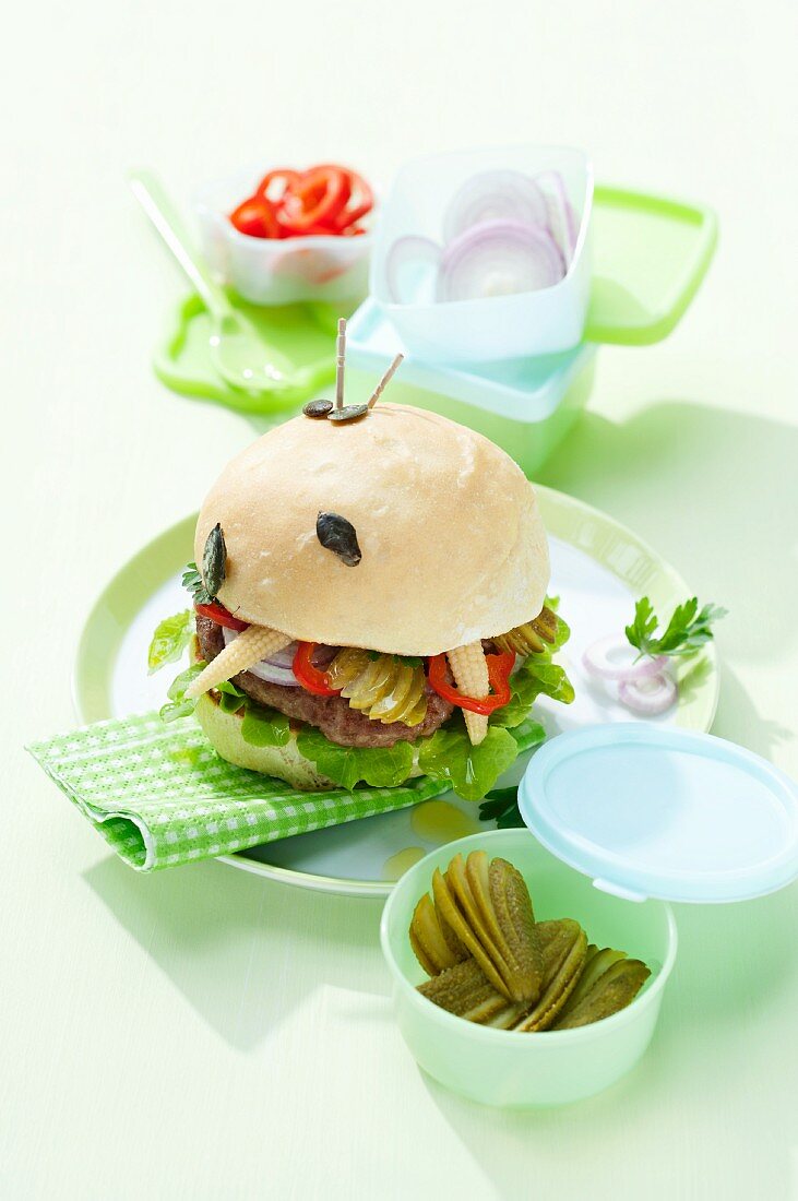 A burger with pickled gherkins and baby corn