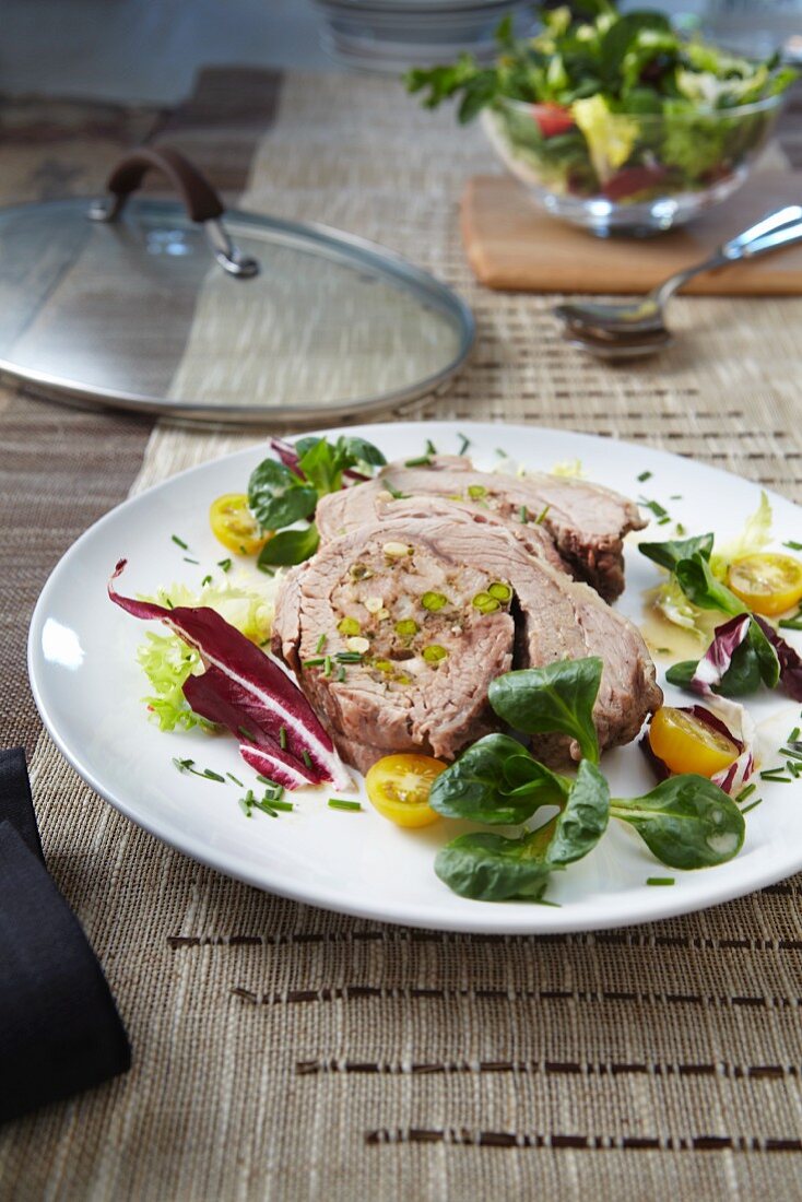 Stuffed breast of veal with salad