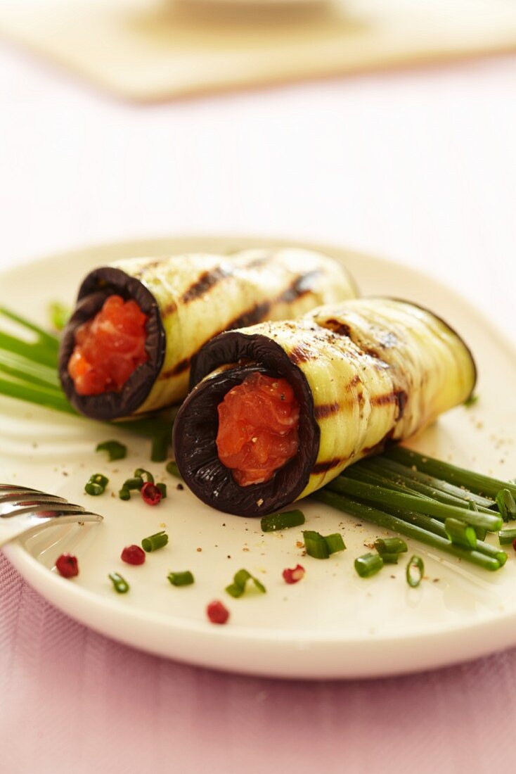 Strips of aubergine, filled with salmon and rolled