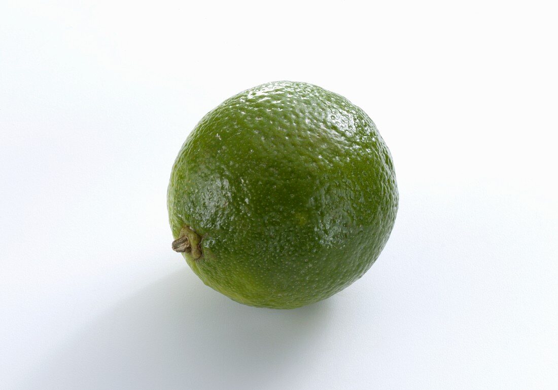 A lime on a white surface