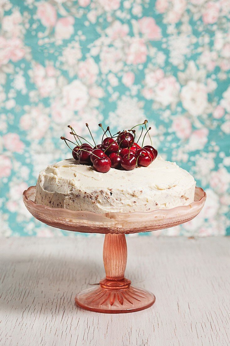 Cherry cake on a cake stand