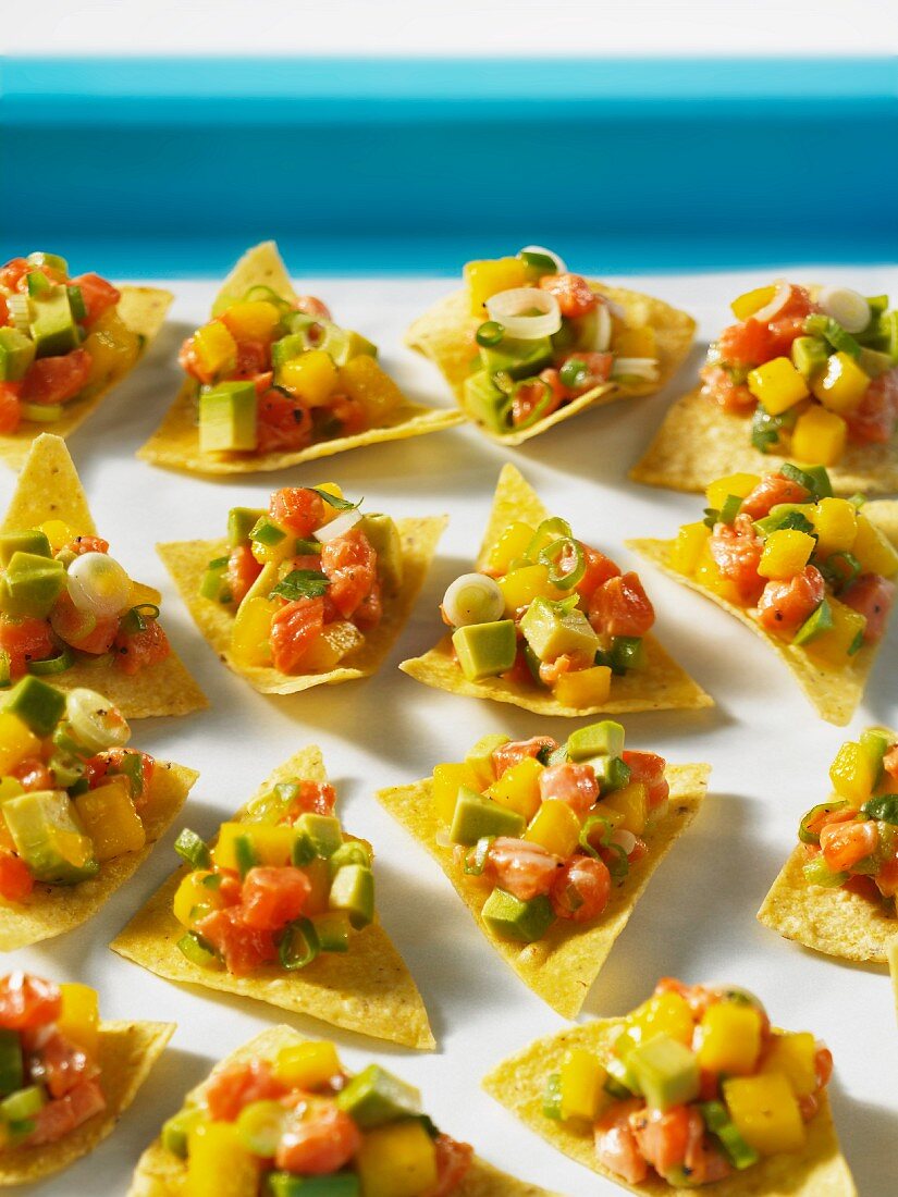 Tortilla chips with mango and salmon ceviche