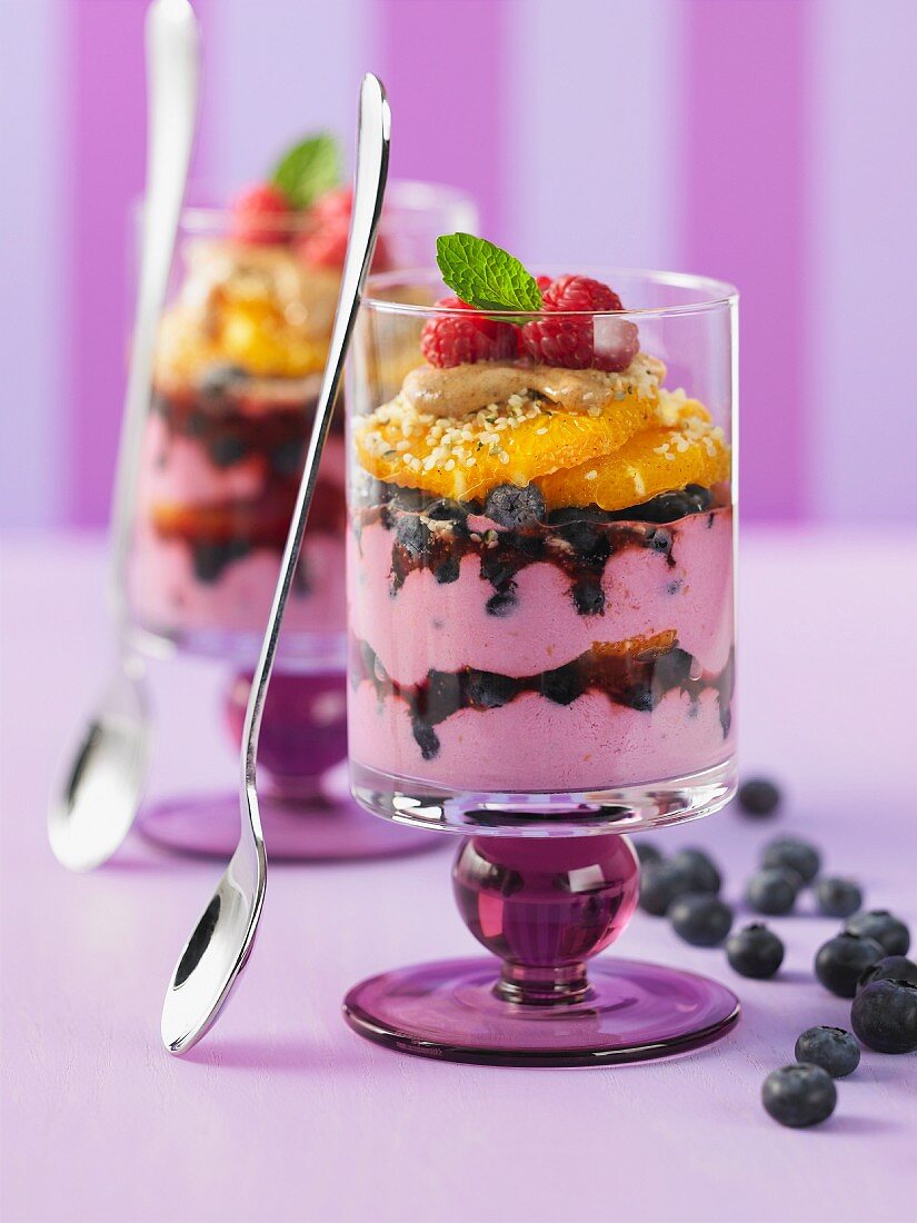 Raspberry parfait with blueberries and oranges