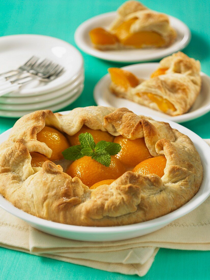 Peach pie with mint leaves