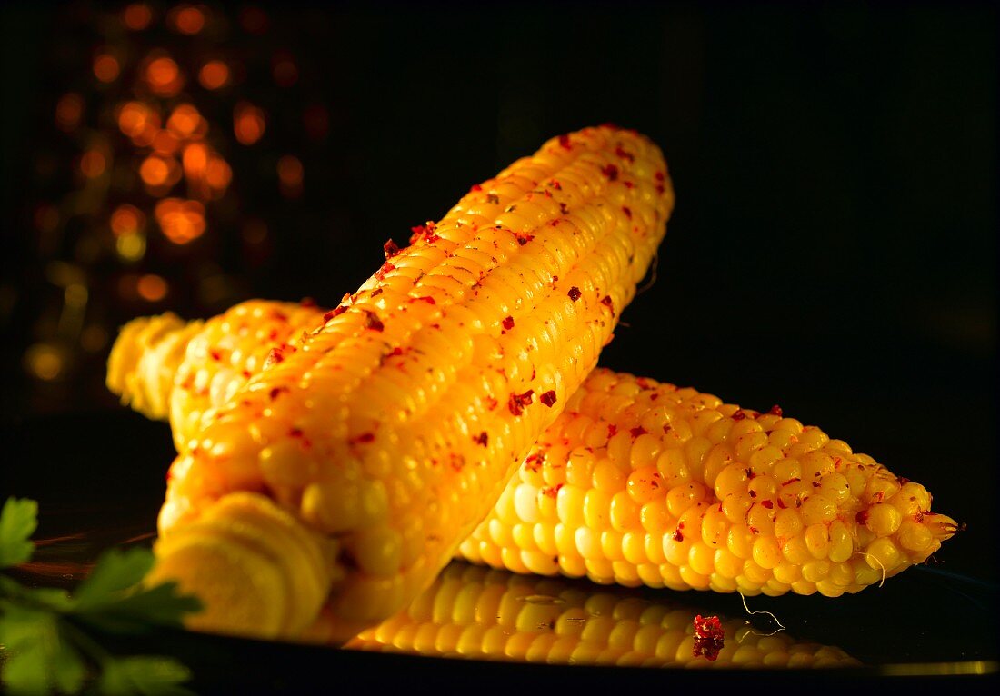 Corn on the cob with red peppercorns