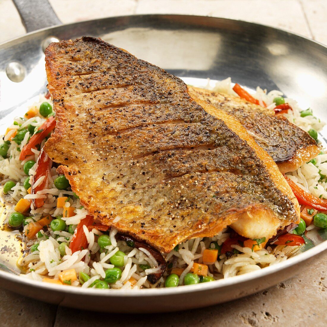Pan Seared White Lake Bass on Bed of Rice and Vegetables