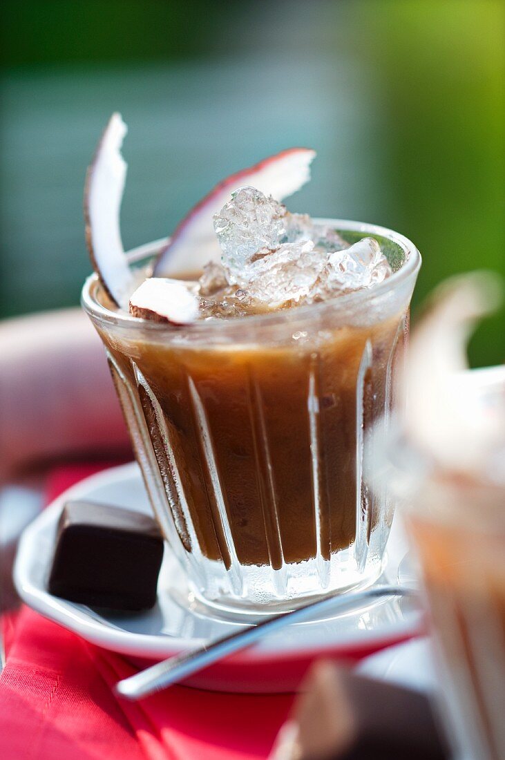 Cold coconut coffee with ice cubes