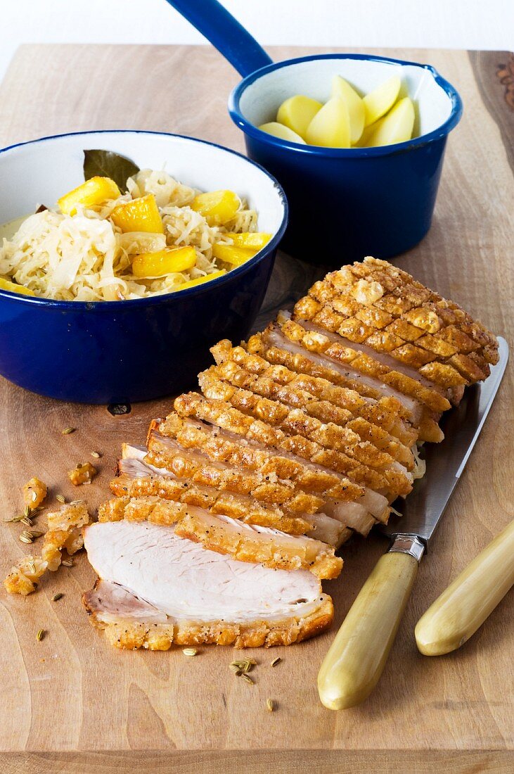 Mustard-crusted roast pork with a pineapple & cabbage medley and potatoes
