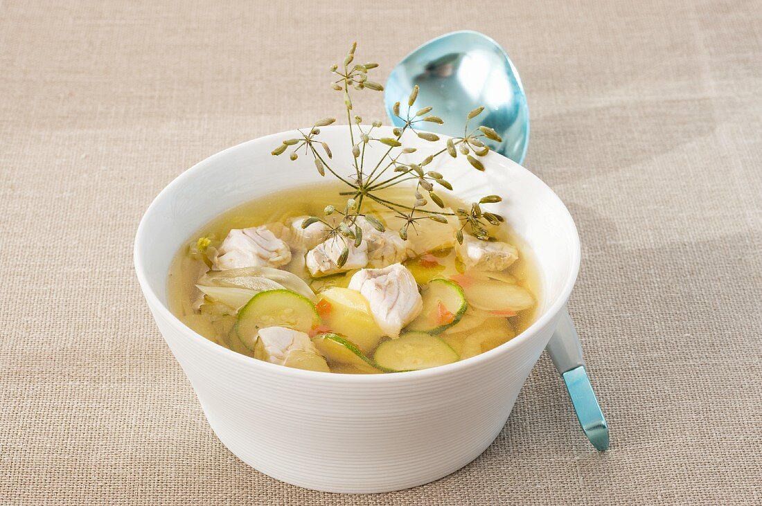 Clear broth with fish and vegetables