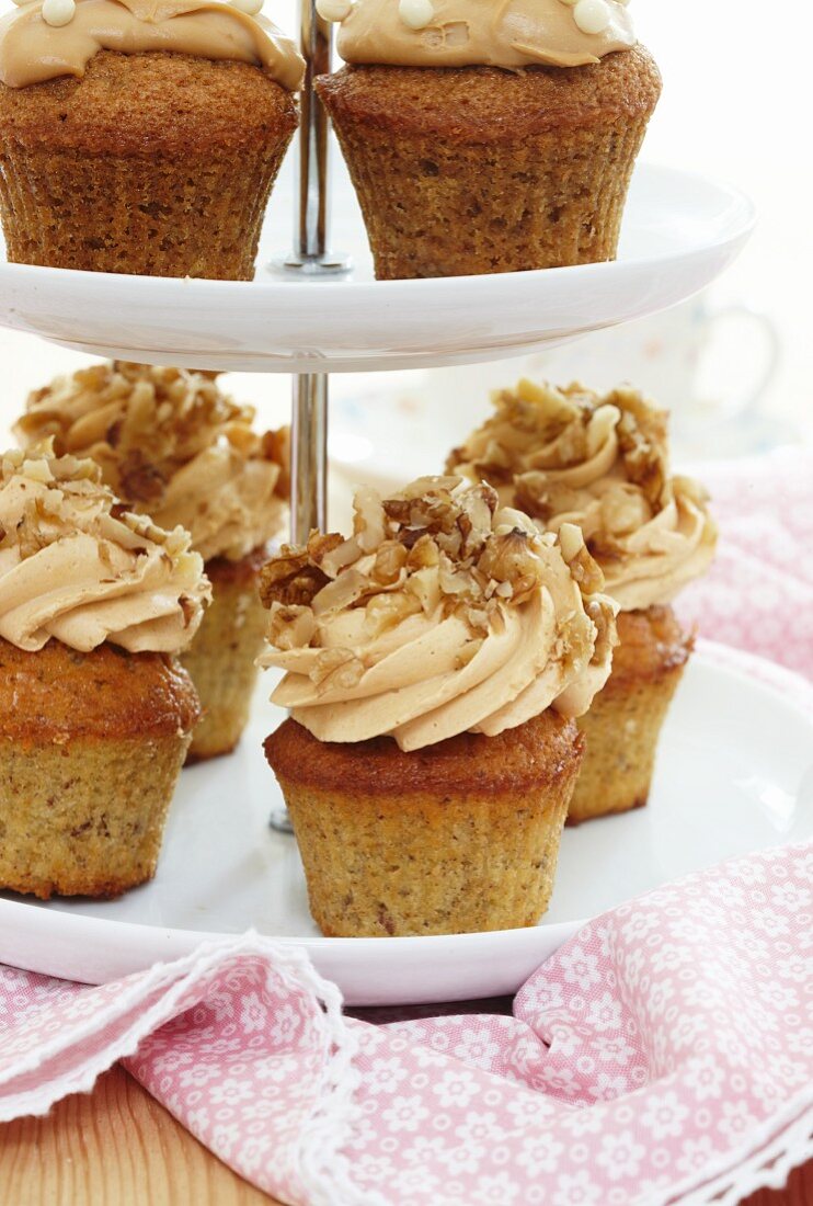 Hazelnut cupcakes on a tiered cake stand