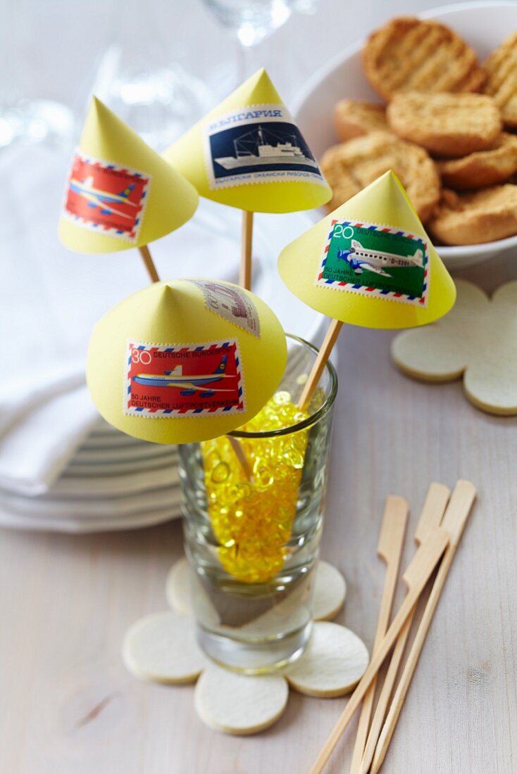 Cocktail skewers decorated with postage stamps