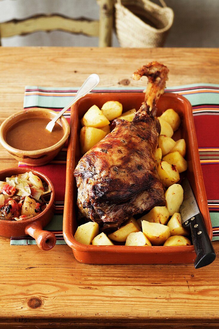 Lamb Al-Horno - Baked Leg Of Lamb, Roast Potatoes, Gravy, Roast Veges - Onion, Tomato, Garlic , Bayleaf