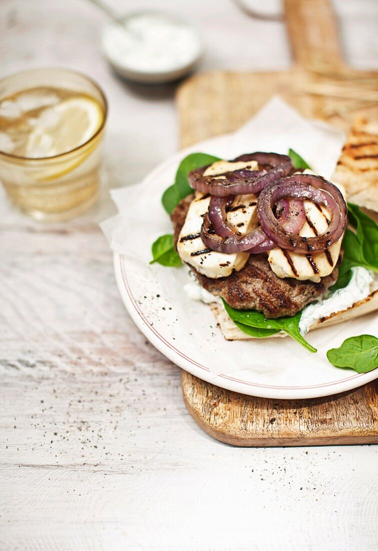 Grilled Geek burger with lamb, halloumi, baby spinach and onions