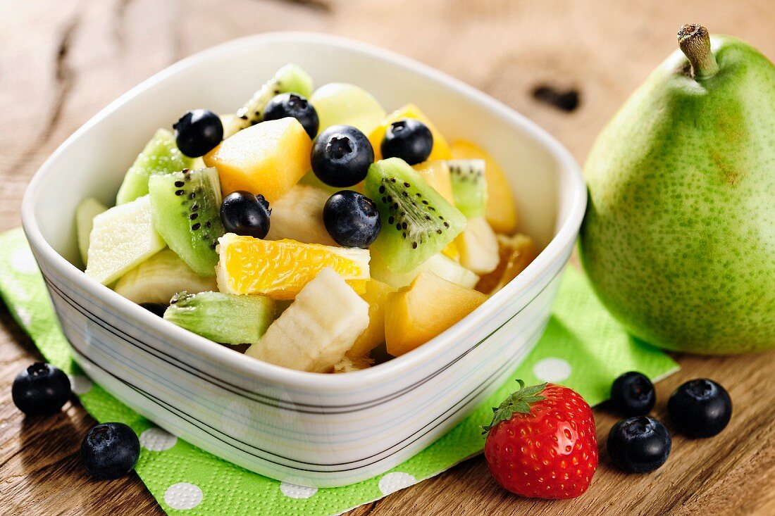 Healthy fresh fruit salad, selective focus