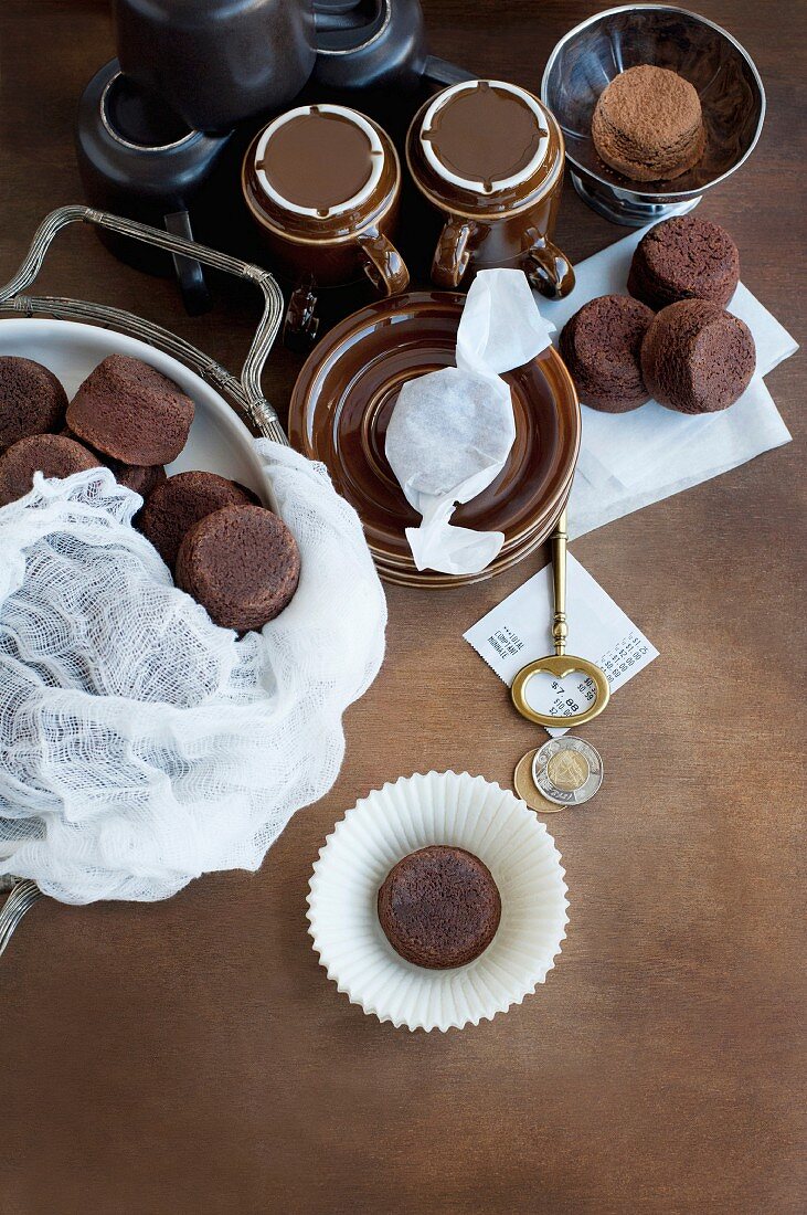 Chocolate muffins served with coffee (view from above)