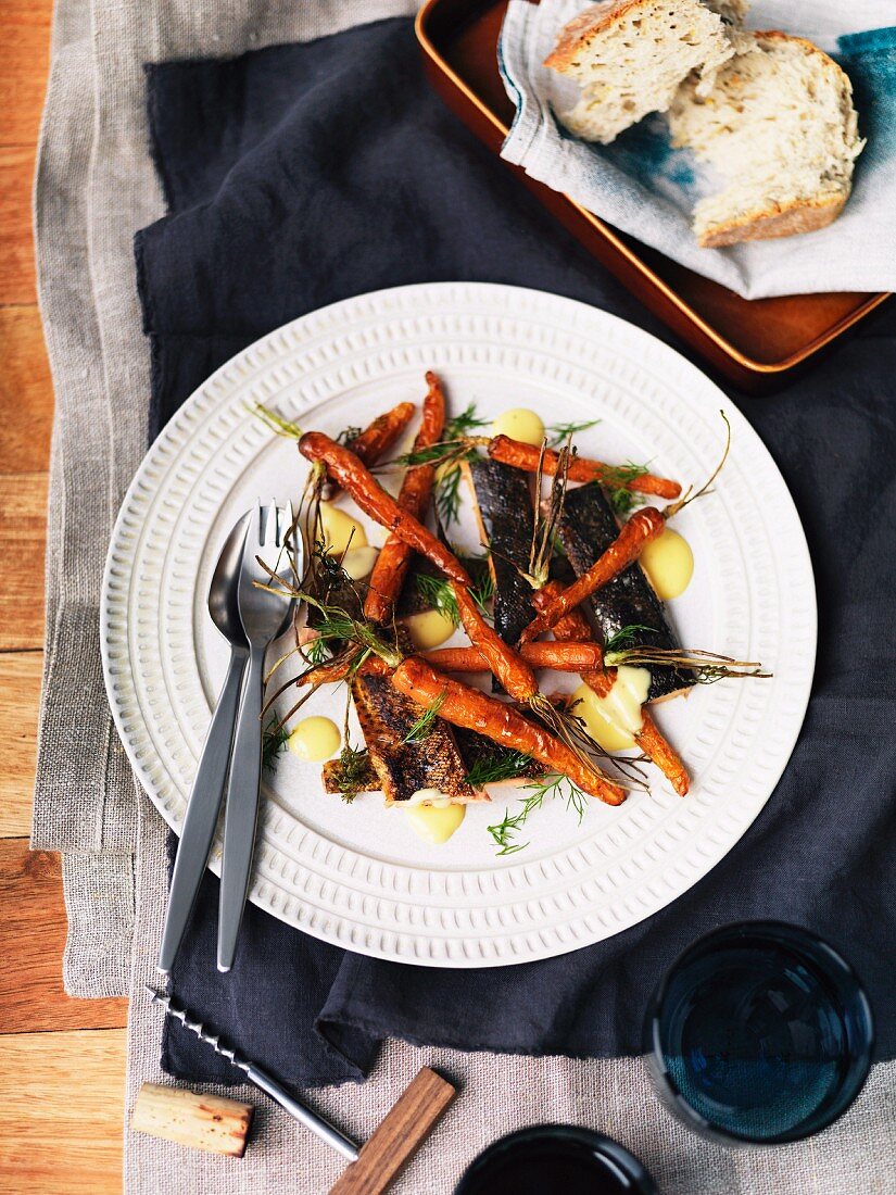 Smoked trout fillets with roast carrots and butter sauce