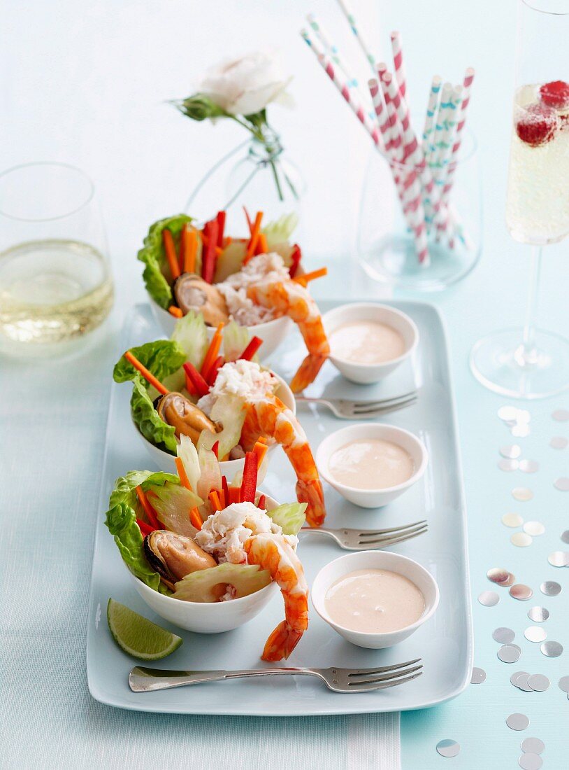 Seafood salad with mayonnaise dressing served in small bowls