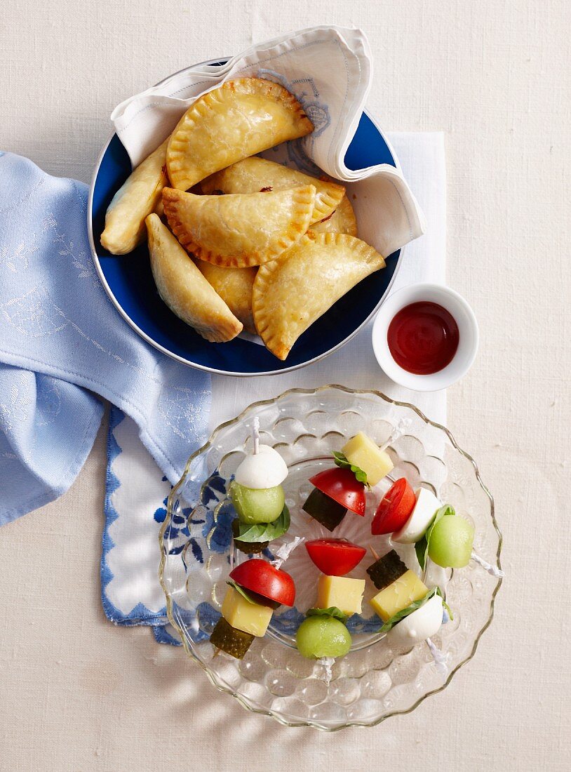 Stuffed pasties and melon skewers