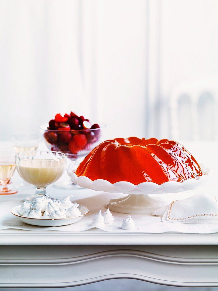 Champagne jelly with sabayon, meringue and a raspberry and melon salad