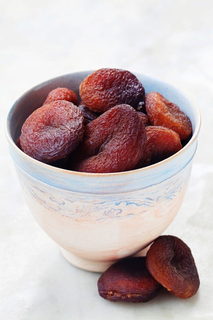 Dried apricots in a ceramic bowl